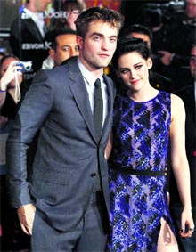 Cast members Robert Pattinson and Kristen Stewart pose at the premiere of The Twilight Saga: Breaking Dawn - Part 1 at Nokia Theatre in Los Angeles