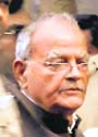 Ex-minister Sukh Ram being escorted out of a court in New Delhi.