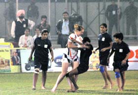 Players of India and England in action during the women Kabaddi World Cup final match in Ludhiana on Sunday. India thrashed the UK 44-17
