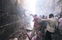Firefighters try to douse flames that engulfed a mall in Mumbai