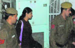 Kanimozhi comes out of a New Delhi court after she was granted bail 