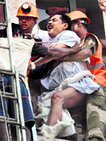 Firemen rescue a patient with an orthopaedic injury.