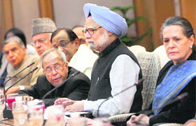 Prime Minister Manmohan Singh, flanked by UPA chairperson Sonia Gandhi and Union ministers at an all-party meeting in New Delhi on Wednesday. 