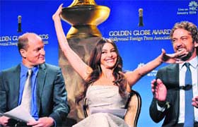 Three is company: Columbian actress Sofia Vergara reacts after being nominated for the 69th Annual Golden Globe Awards with actors Woody Harrelson (L) and actor Gerard Butler Gerard Butler (R)