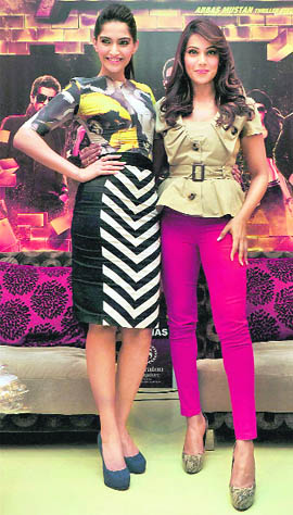 Bollywood actors Sonam Kapoor(L) and Bipasha Basu during a press conference to promote their film Players in Bangalore