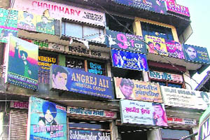 Signboards of singers outside their offices in Ludhiana.