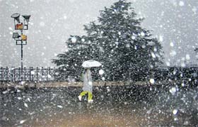 A woman makes the most of Shimlas first snowfall this season