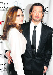Actress Angelina Jolie and Best Actor winner Brad Pitt arrive for the New York Film Critics Circle Awards in New York