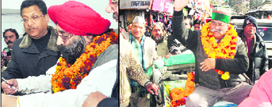 Devender Sethi, Congress candidate from Dehradun Cantt, files nomination papers in Dehradun on Wednesday; and (right) Jot Singh Gunsola, Congress legislator from Mussoorie, goes on a rickshaw to file nomination papers in Mussoorie