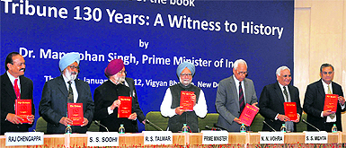 Prime Minister Manmohan Singh (C) with (from left) The Tribune Editor-in-Chief Raj Chengappa, Trustees of The Tribune Trust, Justice (retd) SS Sodhi, RS Talwar (President), NN Vohra, Lt Gen (retd) SS Mehta and Naresh Mohan during the release of the book The Tribune 130 years: A Witness to History at Vigyan Bhavan in New Delhi on Thursday