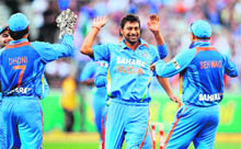 Praveen Kumar celebrates after dismissing an Australian batsman during the second T-20 match in Melbourne on Friday. 
