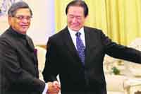 External Affairs Minister SM Krishna with Communist Party of China Politburo member Zhou Yongkang in Beijing 