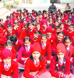 Students listen to experts at an environment awareness event at Mool Chand Shastri Vidyapeeth in Haridwar on Monday.