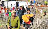 The tantrik father with the body of the three-year-old boy that was exhumed from his house