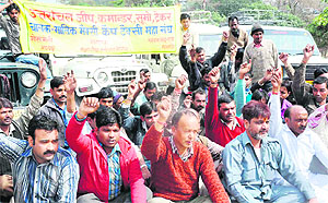 Members of the four-wheeler union of Haridwar hold a protest on Saturday