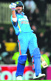 Virat Kohli exults after his blistering unbeaten 133 off 86 balls in Hobart