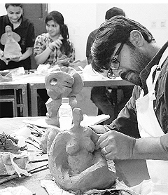 Students take part in a clay modelling workshop at the Chandigarh College of Architecture in Chandigarh on Friday.