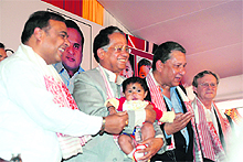 Assam CM Tarun Gogoi with eight-month-old Bishmita, whose cleft lip was operated upon during Operation Smile in Assam.
