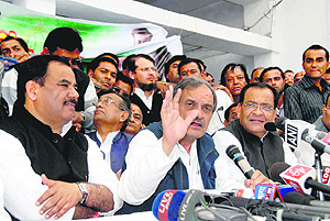 Birender Singh, Congress general secretary and in charge of state affairs, addresses a press conference in Dehradun on Friday. 