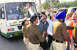 Activists of the VHP stop a Jammu-bound bus at ISBT-43 in Chandigarh on Saturday