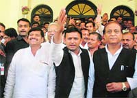 Samajwadi Party Legislature Party leader Akhilesh Yadav (C) coming out of Raj Bhawan in Lucknow