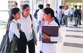 Students of the UIMS, Panjab University, wait for their interview during the job festival at the south campus, Sector 25, Chandigarh, on Wednesday