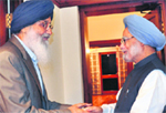 Punjab CM Parkash Singh Badal greets PM Manmohan Singh in New Delhi