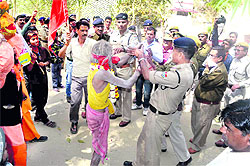 The police stops people from entering Maa Chamunda Devi temple situated in the Rajaji National Park in Haridwar on Friday