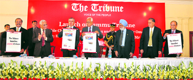J&K Chief Minister Omar Abdullah (third from left) unveils Jammu Tribune at a function in Jammu on Friday. Others on the dais (from left to right) are: The Tribune Editor-in-Chief Raj Chengappa, The Tribune Trustee Lt-Gen (retd) SS Mehta, Chief Guest J&K Governor NN Vohra, Trustee Justice (retd) SS Sodhi, Trustee Naresh Mohan and General Manager Sanjay Hazari.