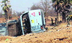 Security personnel inspect the site where 15 CRPF personnel were killed in a Maoist attack in Maharashtra on Tuesday