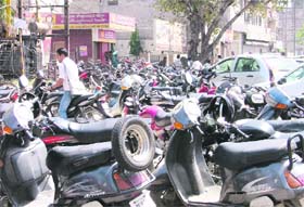 In the absence of parking space majority of the customers visiting banks are left with no option but to park their vehicles on the roadside resulting in traffic jams near Manju Cinema