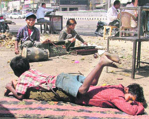 Even as the government has been trying best to keep a check on child labour, boys perform along a street in Ludhiana on Wednesday.