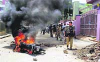 Police patrols a violence-hit area in Hyderabad