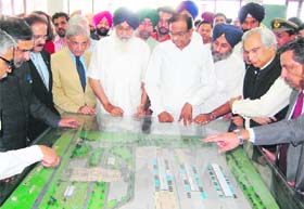 (L-R) Union Commerce Minister Anand Sharma, Pak Commerce Minister Makdoom Amin Fahim, Pakistan Punjab CM Shahbaz Sharif, Punjab CM Parkash Singh Badal, Union Home Minister P Chidambaram and deputy CM Sukhbir Singh Badal having a look at the Integrated Check Post (ICP) model at Attari on Friday
