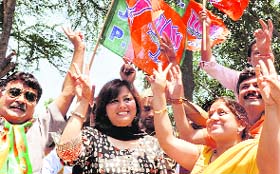 BJP supporters celebrate the partys victory in New Delhi on Tuesday