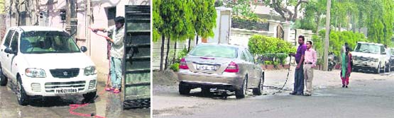 Men wash their cars at Bhadaur House and Rakh Bagh areas in Ludhiana. Photos: Inderjeet Verma