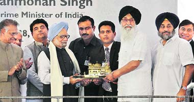 PM Manmohan Singh being felicitated by a replica of the Golden Temple by Punjab CM Parkash Singh Badal at the inauguration ceremony of Guru Gobind Singh Refinery in Bathinda on Saturday