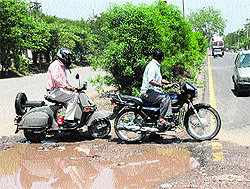 Two-wheeler riders risk their lives by crossing the road separating Phases I and II of the Industrial Area in Panchkula