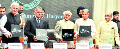 Vice-President Hamid Ansari (3rd from left) releases a souvenir on the golden jubilee celebration function of the Punjab and Haryana Bar Council in Chandigarh on Saturday. Also seen are (L to R) Union Law and Justice Minister Salman Khurshid, Punjab Governor Shivraj Patil, Parliamentary Affairs Minister Pawan Kumar Bansal and Supreme Court Judge Swatanter Kumar.