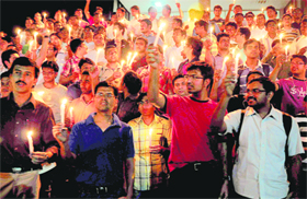 Resident doctors take part in a candle march in support of their demands at the PGI in Chandigarh on Sunday.