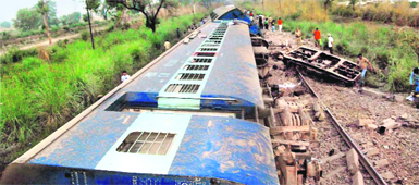 Overturned coaches of the Ferozepur-Mumbai Punjab Mail at the accident site near Kharawar village in Rohtak. 