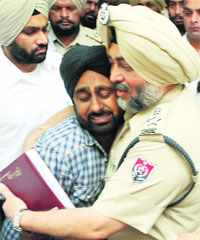 SSP Surjit Singh consoles a mourning relative of a victim in Moga on Monday. 