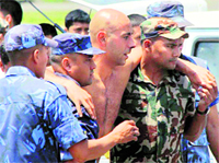 Crash survivor Anoreas Rasch from Denmark is taken to a hospital in Pokhara.