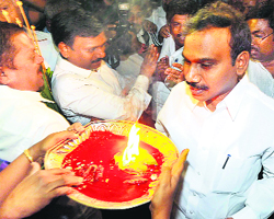 Raja arrives at his Delhi home on Tuesday. 