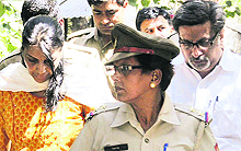 Nupur and Rajesh Talwar outside a CBI court in Ghaziabad on Thursday