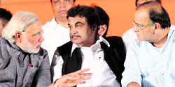 BJPs Narendra Modi with party chief Nitin Gadkari and senior leader Arun Jaitley in Mumbai on Friday.