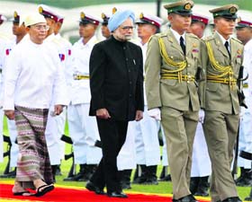 Prime Minister Manmohan Singh and Myanmar President Thein Sein inspect guard of honour during a ceremonial reception in Nay Pyi Taw on Monday