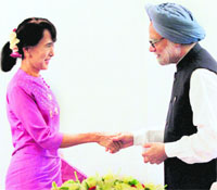 PM Manmohan Singh and Myanmar's Opposition leader Aung San Suu Kyi in Yangon on Tuesday. 