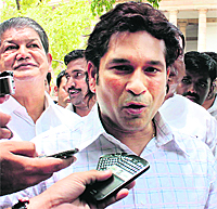 Sachin Tendulkar talks to mediapersons after taking oath as MP in Rajya Sabha.