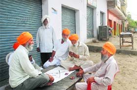 Villagers at a market at Fatehgarh Sikri village near Begowal in Kapurthala